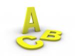 Buchstaben aus gelbem Acryl in einer Detailansicht